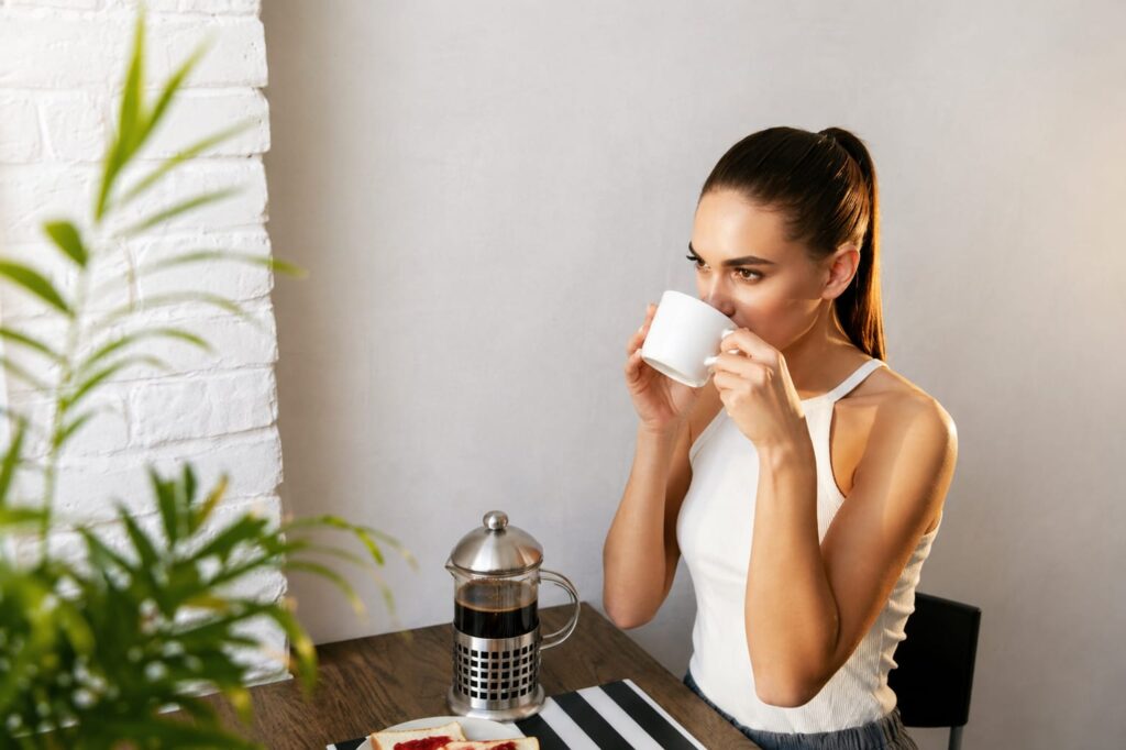 woman drinking coffee Java Burn discount code morning healthy routine metabolism support